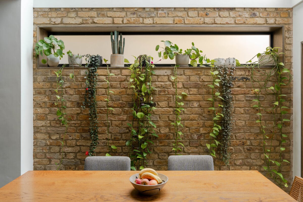 A Restored Victorian House with Exposed Brick and a Kitchen Extension 7 exposed brick wall with plants