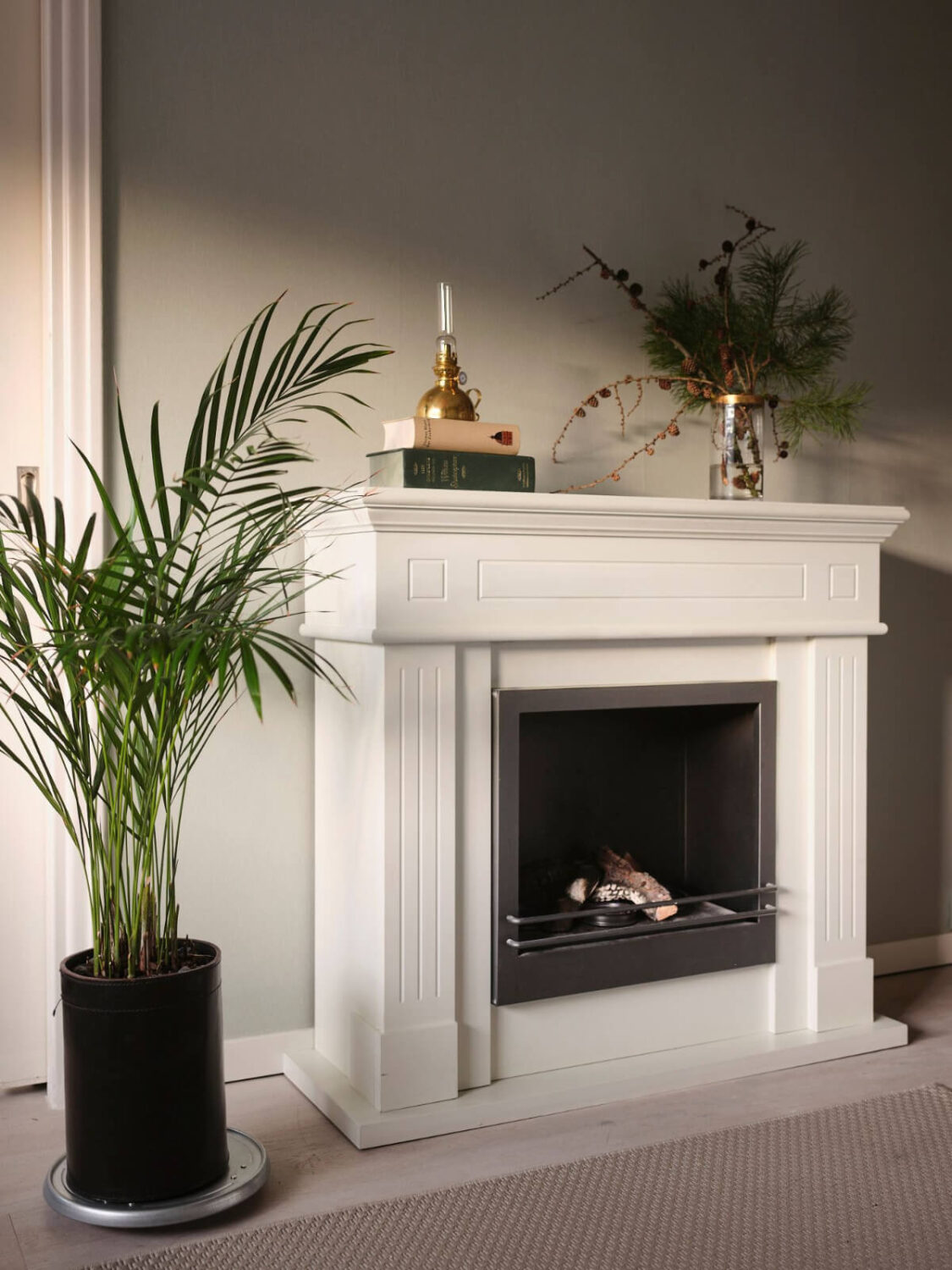 A Small Stockholm Apartment with a Tiny Green Bedroom 5 fireplace