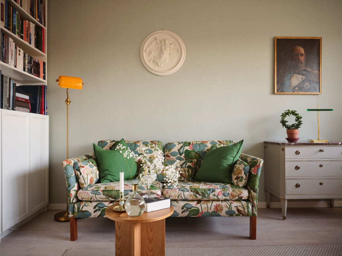 A Small Stockholm Apartment with a Tiny Green Bedroom 3 floral sofa