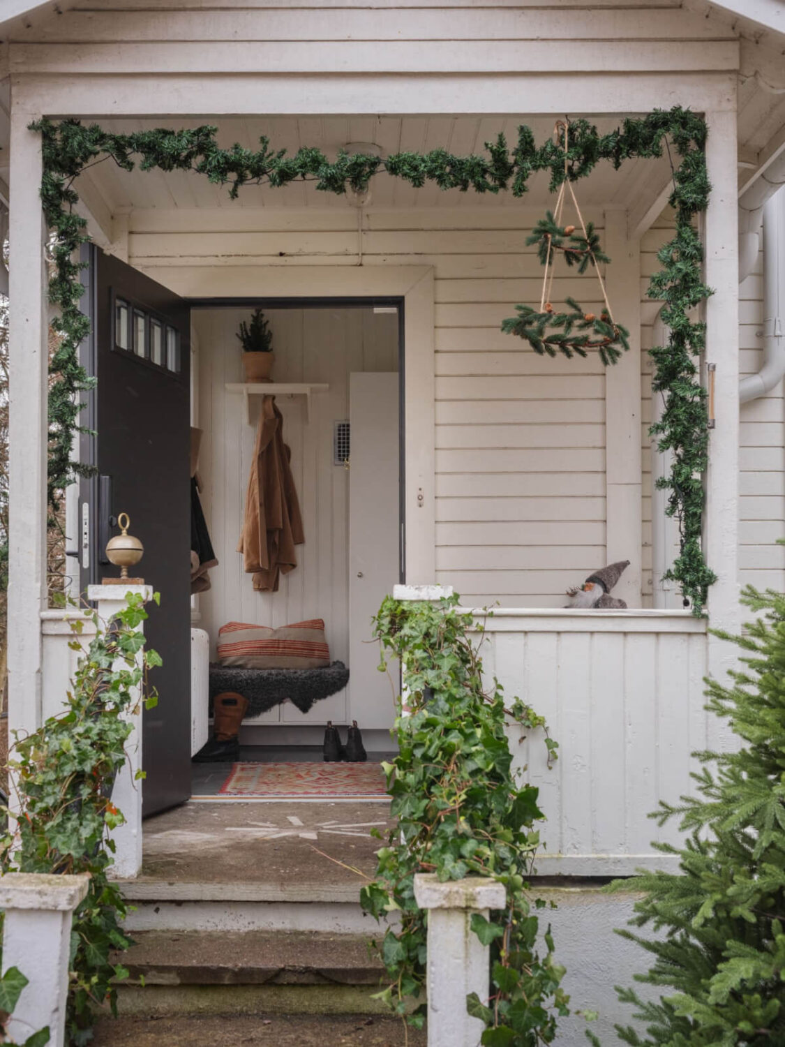 A Beautiful Turn-of-the-Century Family Home in Sweden 49 front porch christmas garland