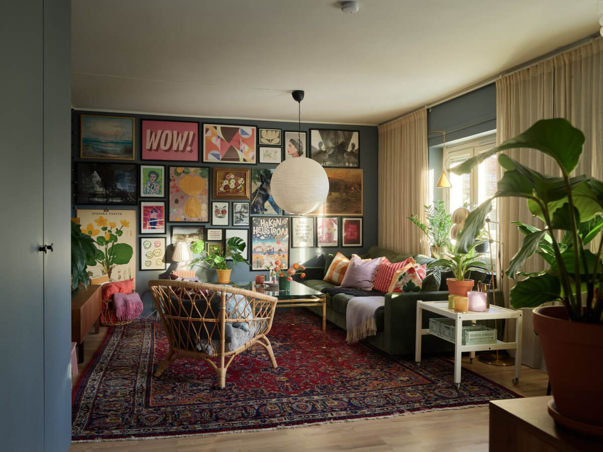 A Colorful Midcentury Apartment Filled with Art and Plants 3 gallery wall living room large rug