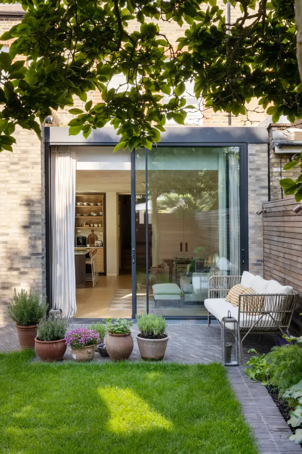 A Timeless Energy-Efficient Victorian Townhouse in Bedford Park 22 garden glass doors kitchen extension