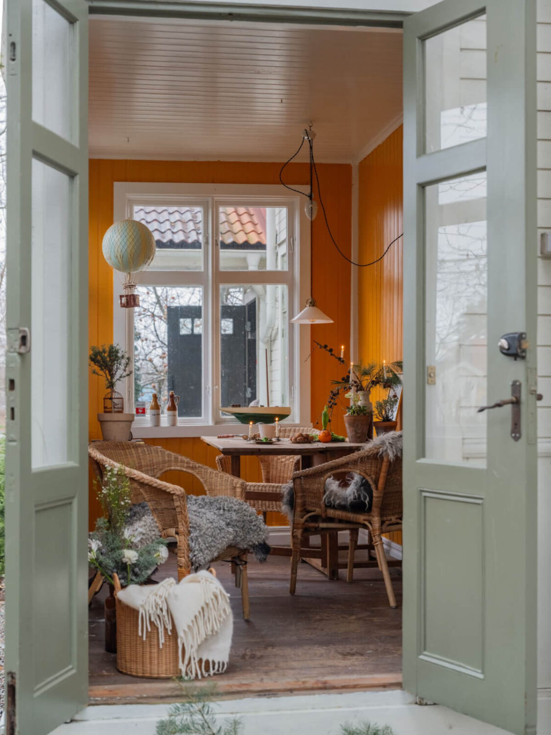 A Beautiful Turn-of-the-Century Family Home in Sweden 20 garden room orange walls