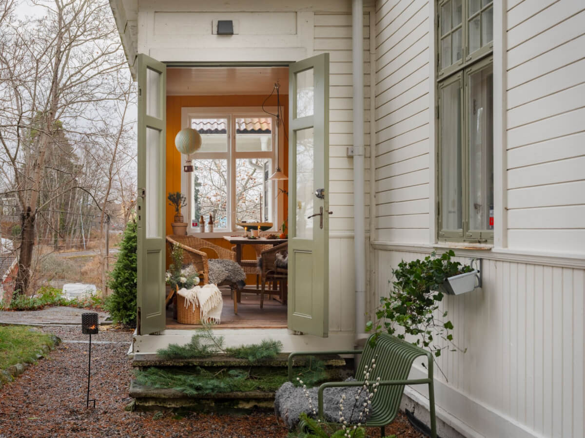 A Beautiful Turn-of-the-Century Family Home in Sweden 22 garden room orange walls swedish home