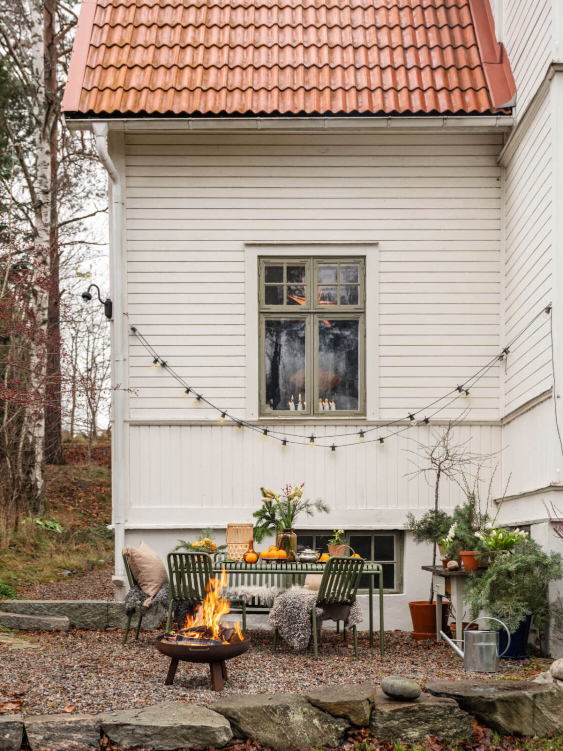 A Beautiful Turn-of-the-Century Family Home in Sweden 48 garden table string light