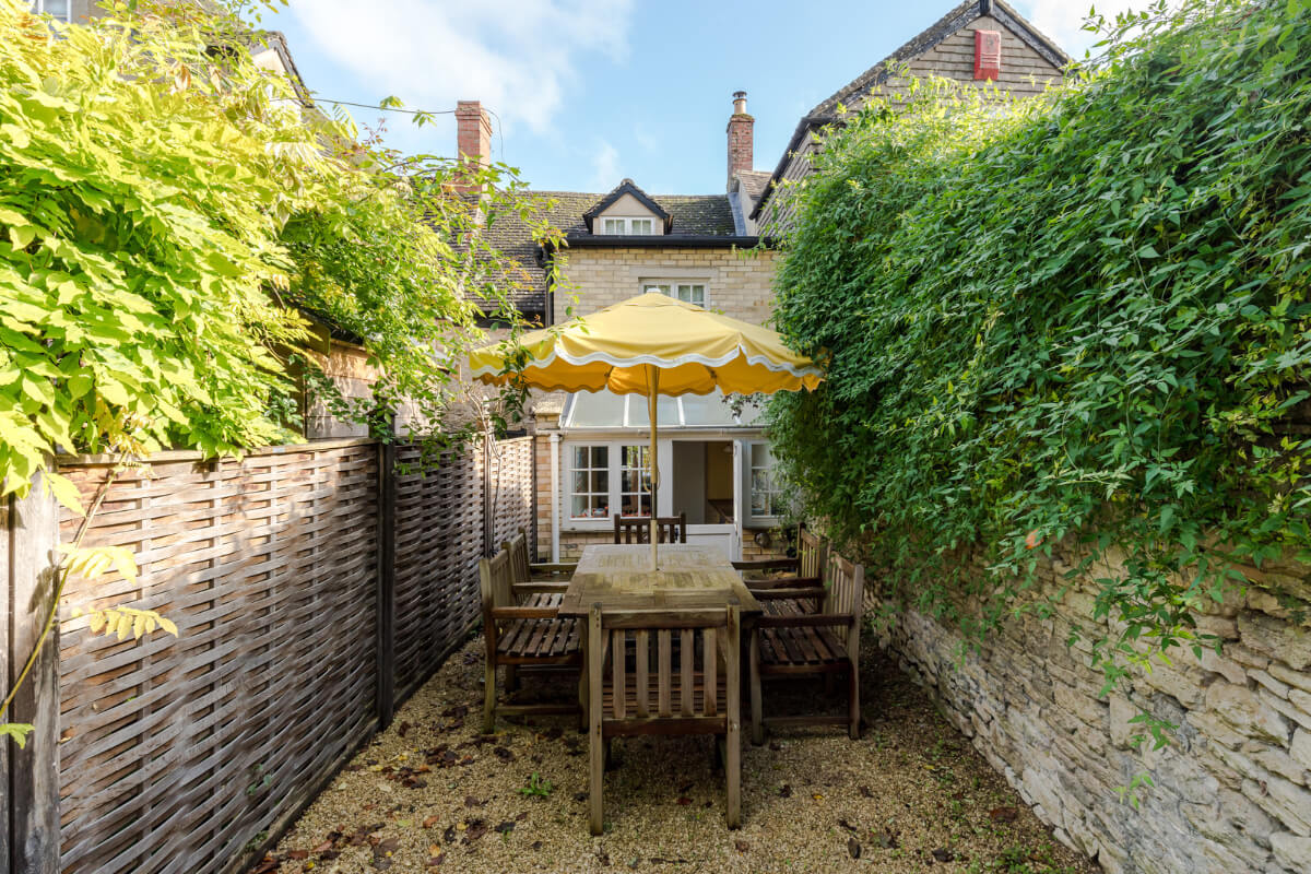 A Carefully Selected Color Palette in an 18th-Century English Cottage 17 garden with stone wall