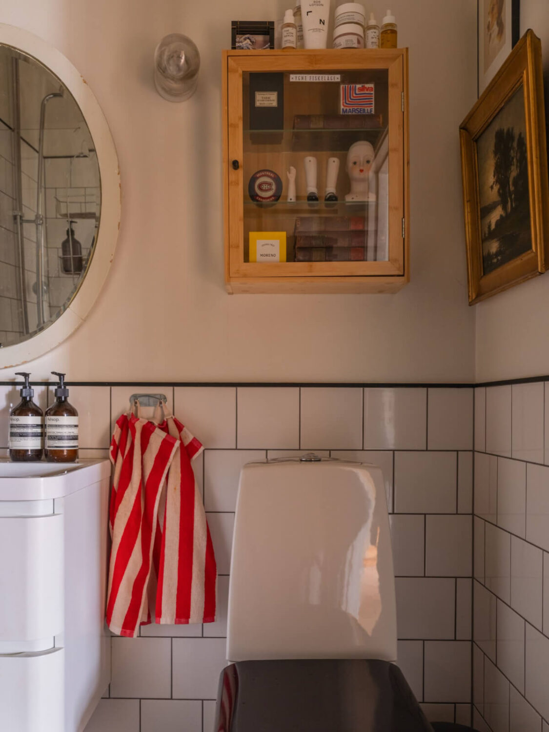 A Beautiful Turn-of-the-Century Family Home in Sweden 30 glass fronted cabinet above toilet