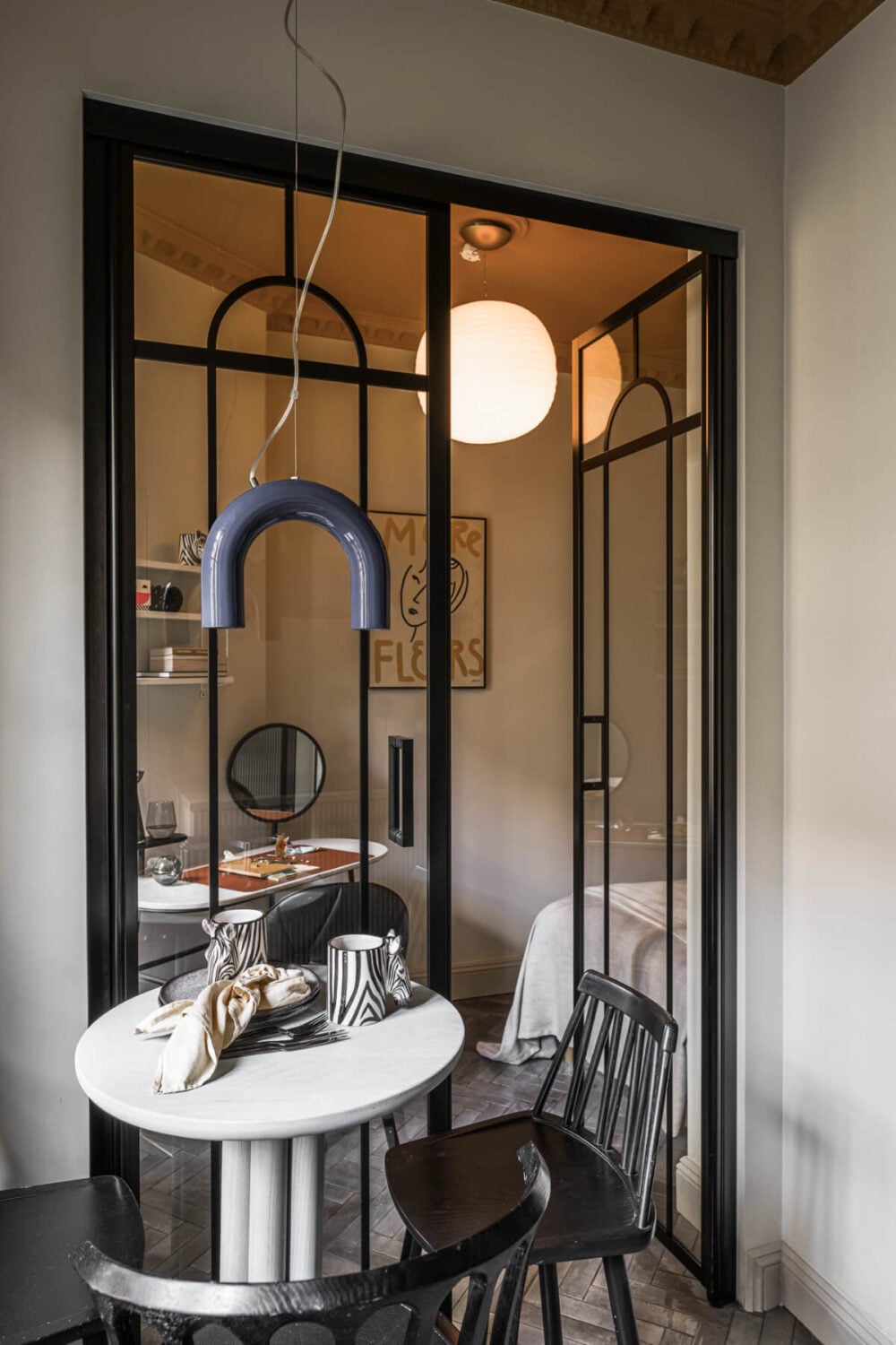 A Swedish Apartment with Exclusive Materials and Monochrome Color Scheme 11 glass industrial door to bedroom