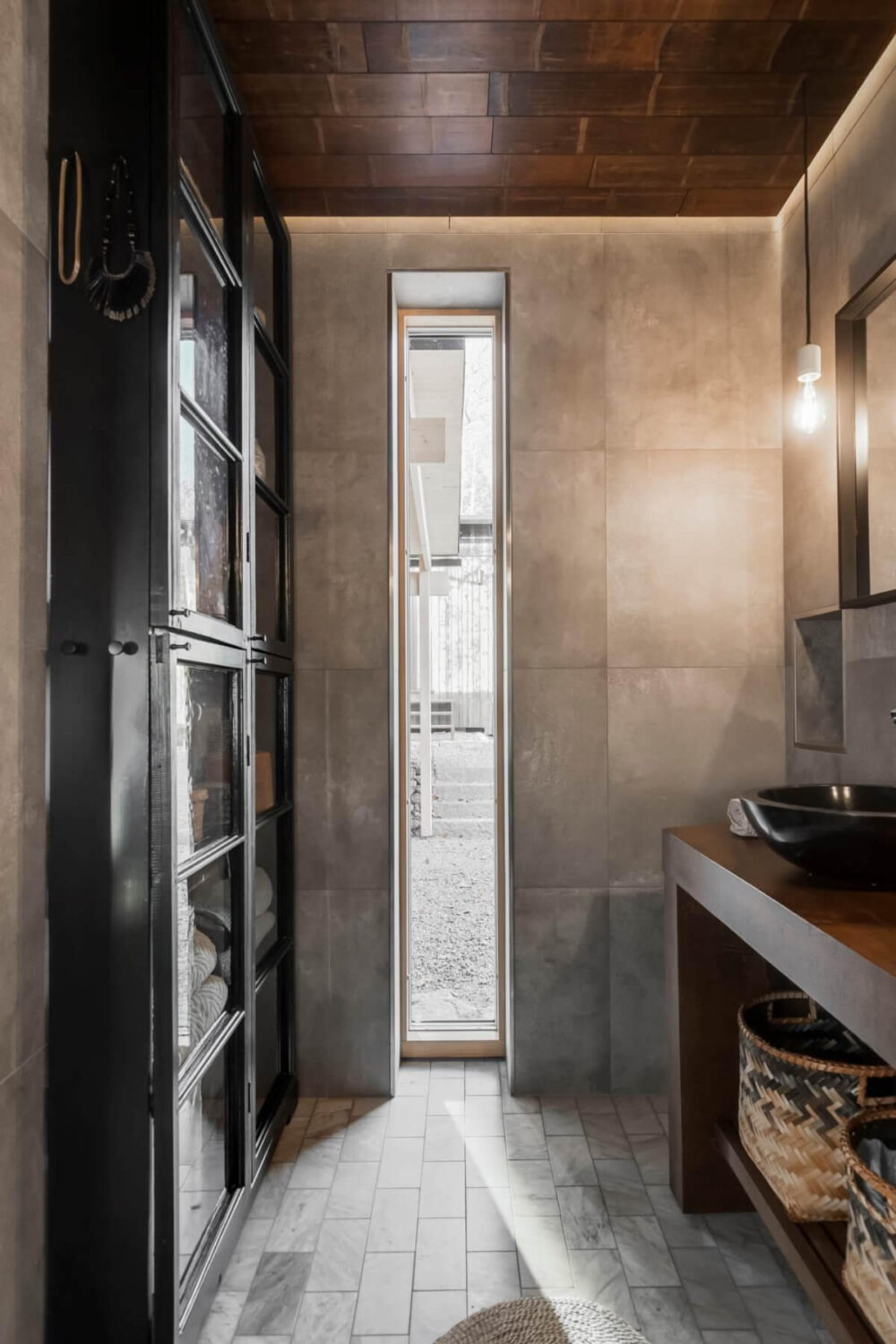 A Swedish Architectural Villa Surrounded by Nature 16 gray bathroom floor to ceiling glass cabinets