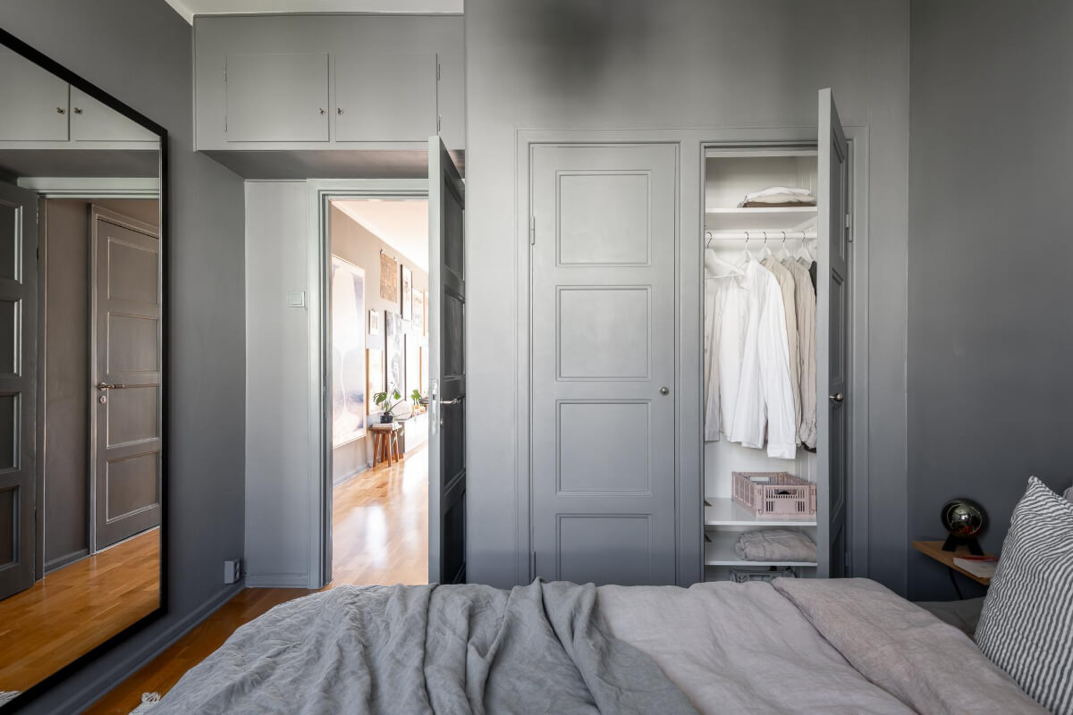Light Rooms and a Moody Color Palette in a 1930s Apartment 23 gray bedroom built in wardrobes