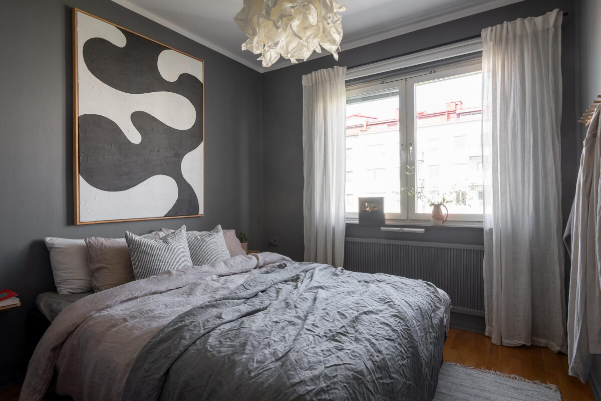 Light Rooms and a Moody Color Palette in a 1930s Apartment 21 gray bedroom large artwork