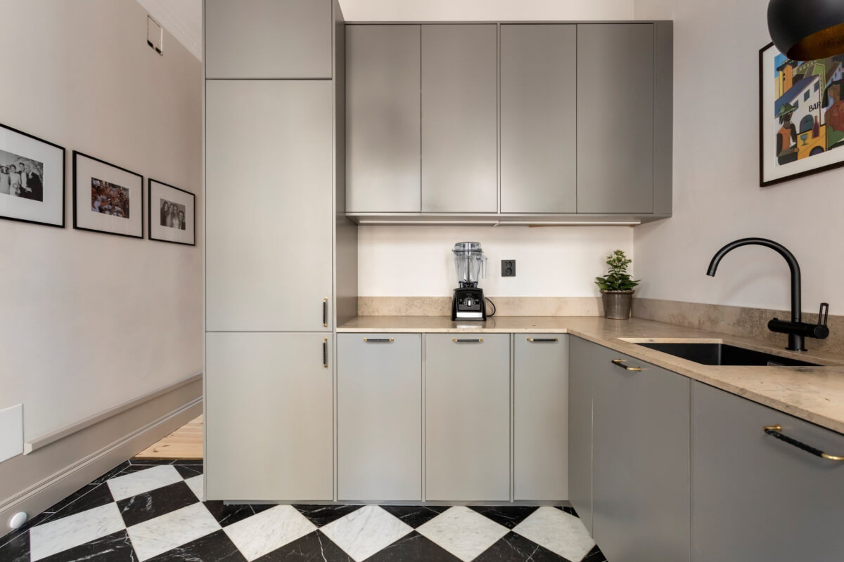 A Stylish Two-Bedroom Apartment in Stockholm 12 gray kitchen checkerboard floor open floorplan to hall