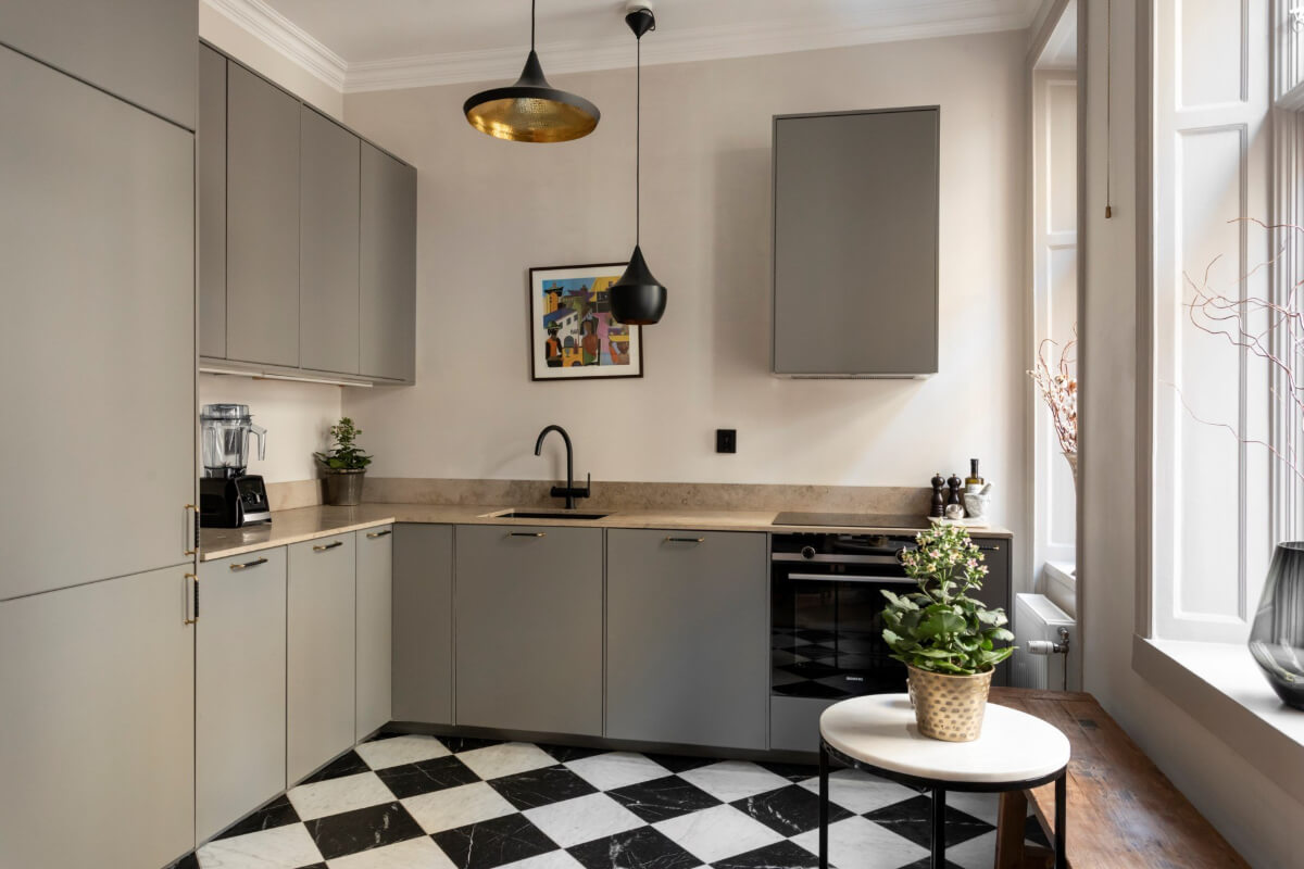 A Stylish Two-Bedroom Apartment in Stockholm 10 gray kitchen checkerboard floor tiny breakfast table rustic wooden bench