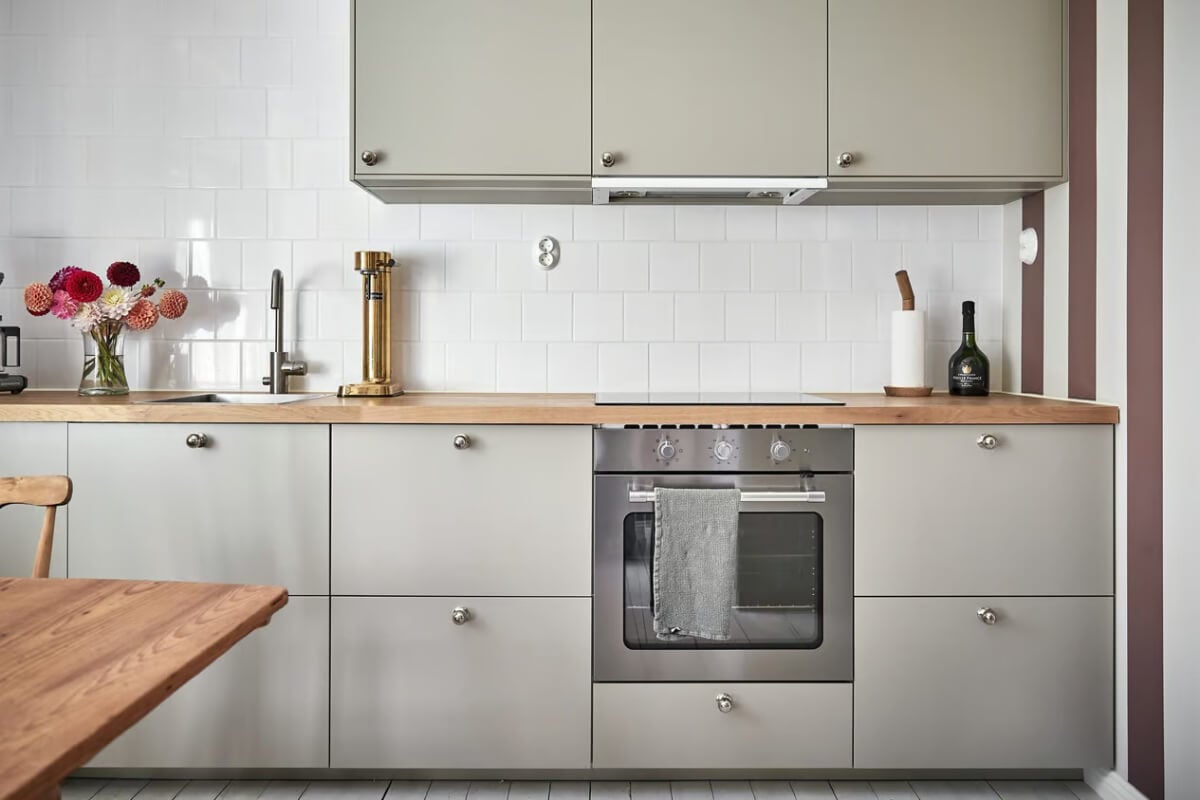 A Bright Turn-of-the-Century Apartment in Sweden 8 gray kitchen wooden countertop