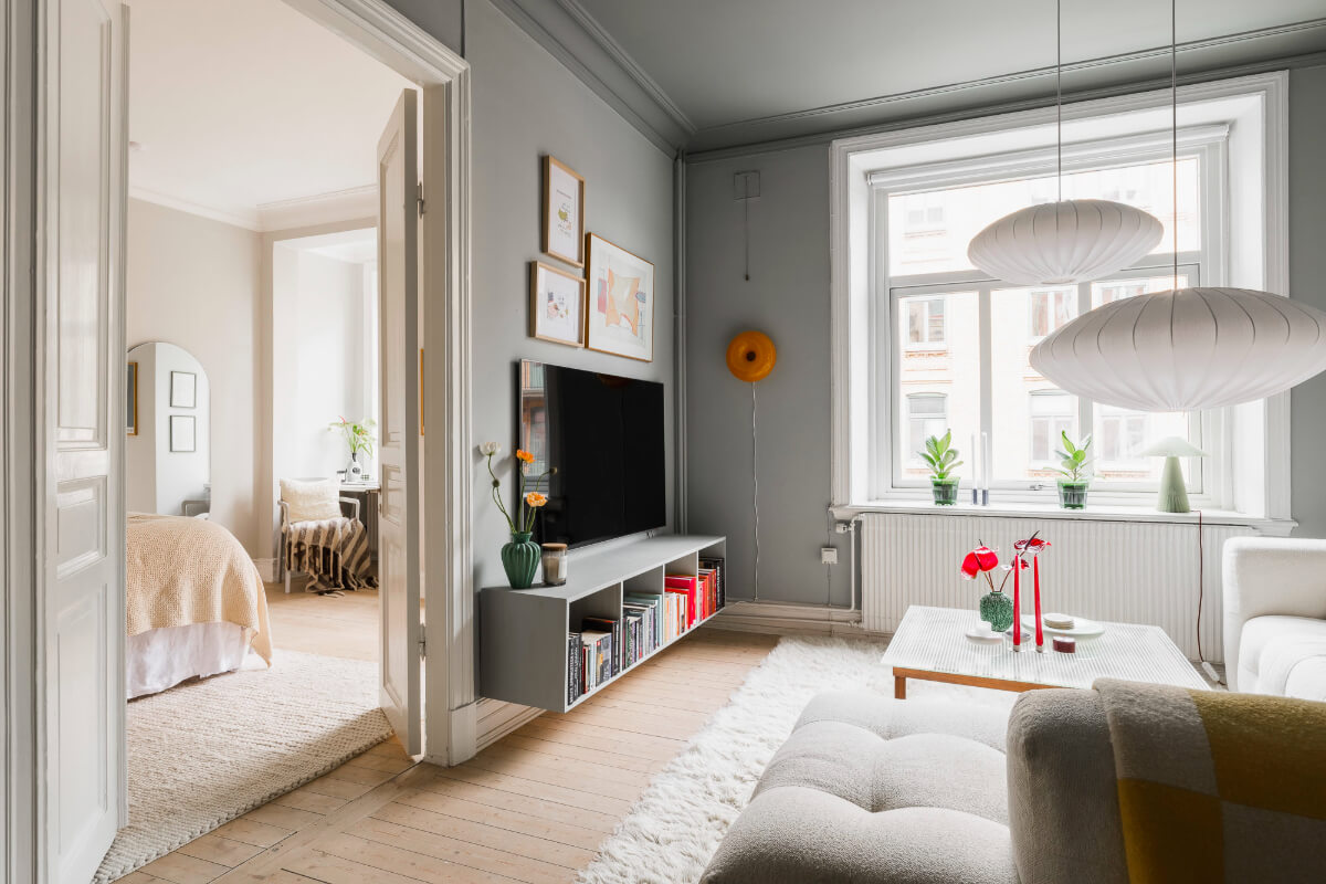 An Early 20th-Century Apartment with a Pink Kitchen 6 gray living room double doors