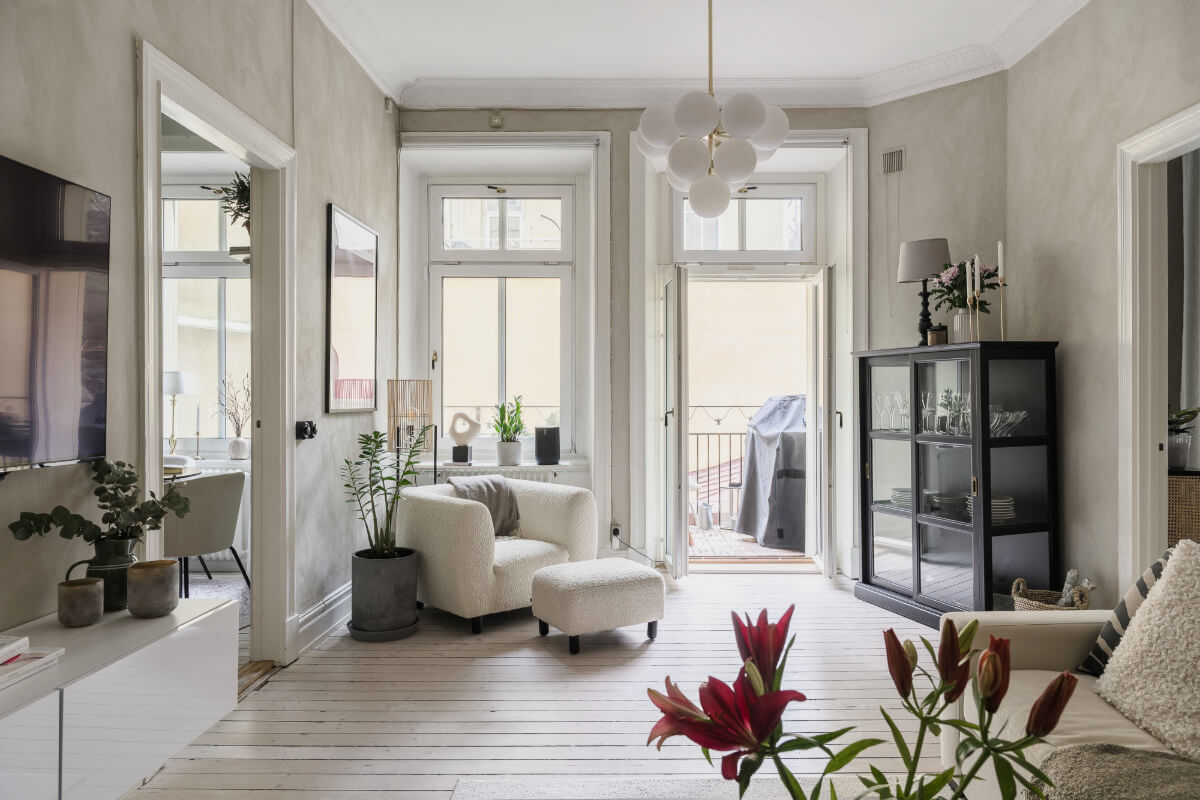 Limewash Wall and Period Features in a Swedish Apartment 1 gray living room large windows