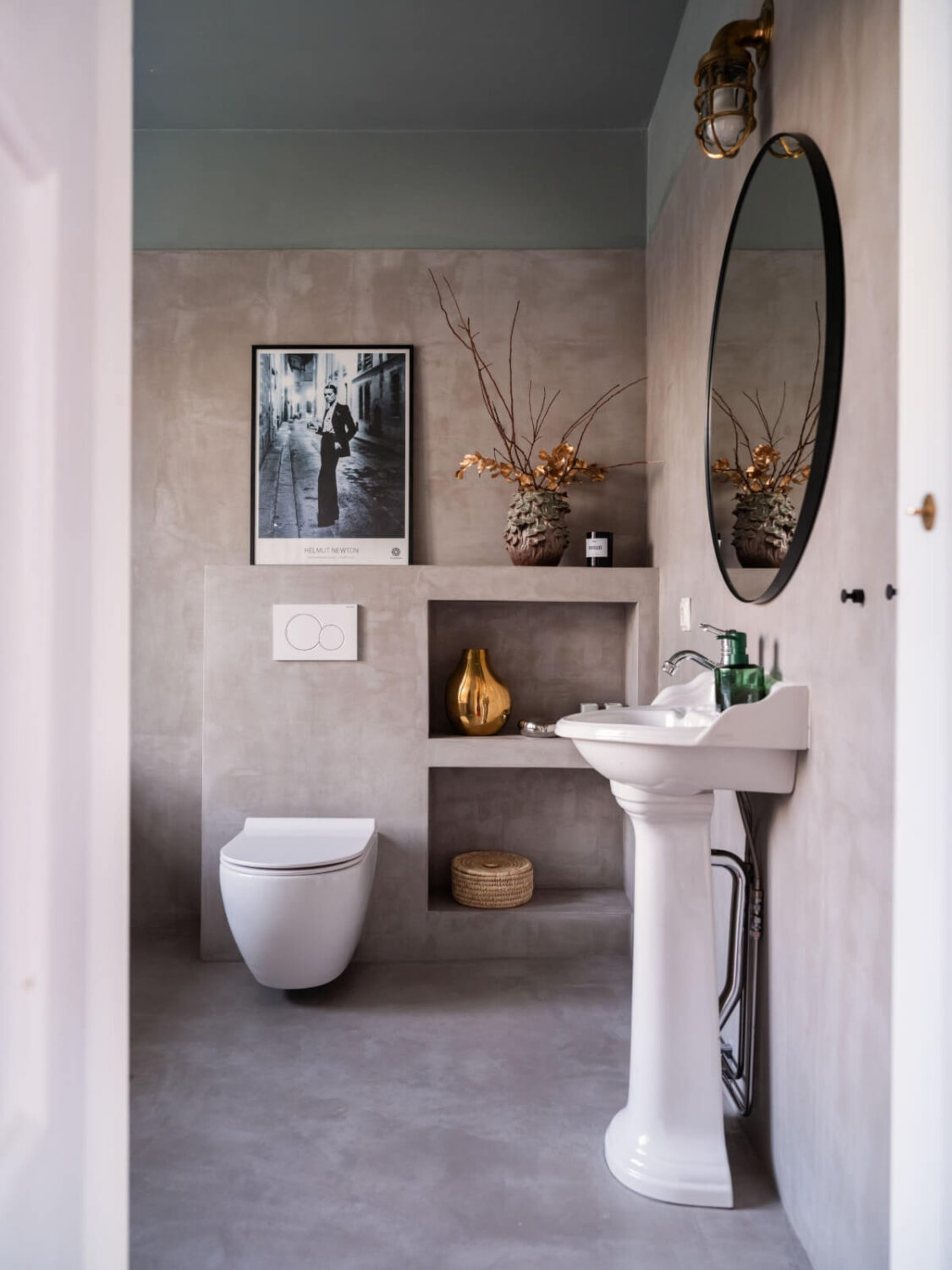 Painted Floorboards in a Unique Family Home in Sweden 10 gray plaster bathroom