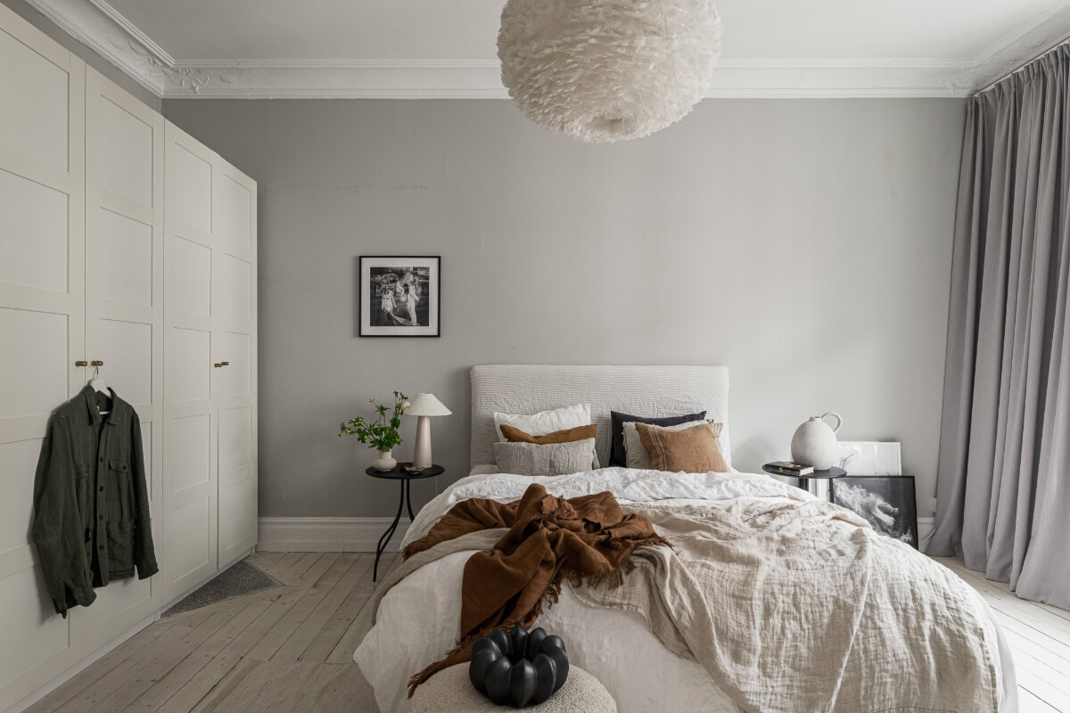 Period Features and Contemporary Solutions in Gothenburg 11 gray walls bedroom wooden floor wardrobes