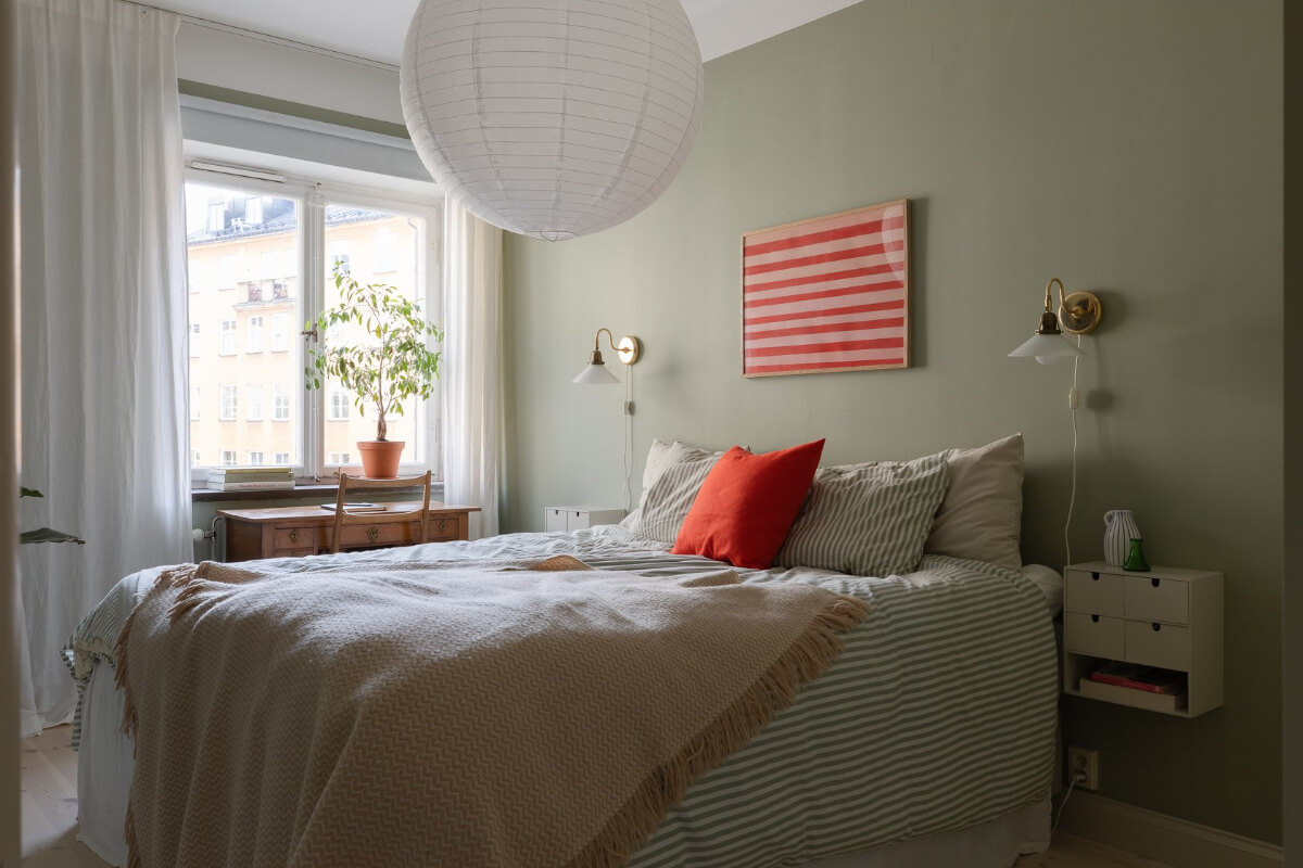 Modern Interiors in a Bright 1930s Apartment in Sweden 21 green bedroom striped bedding