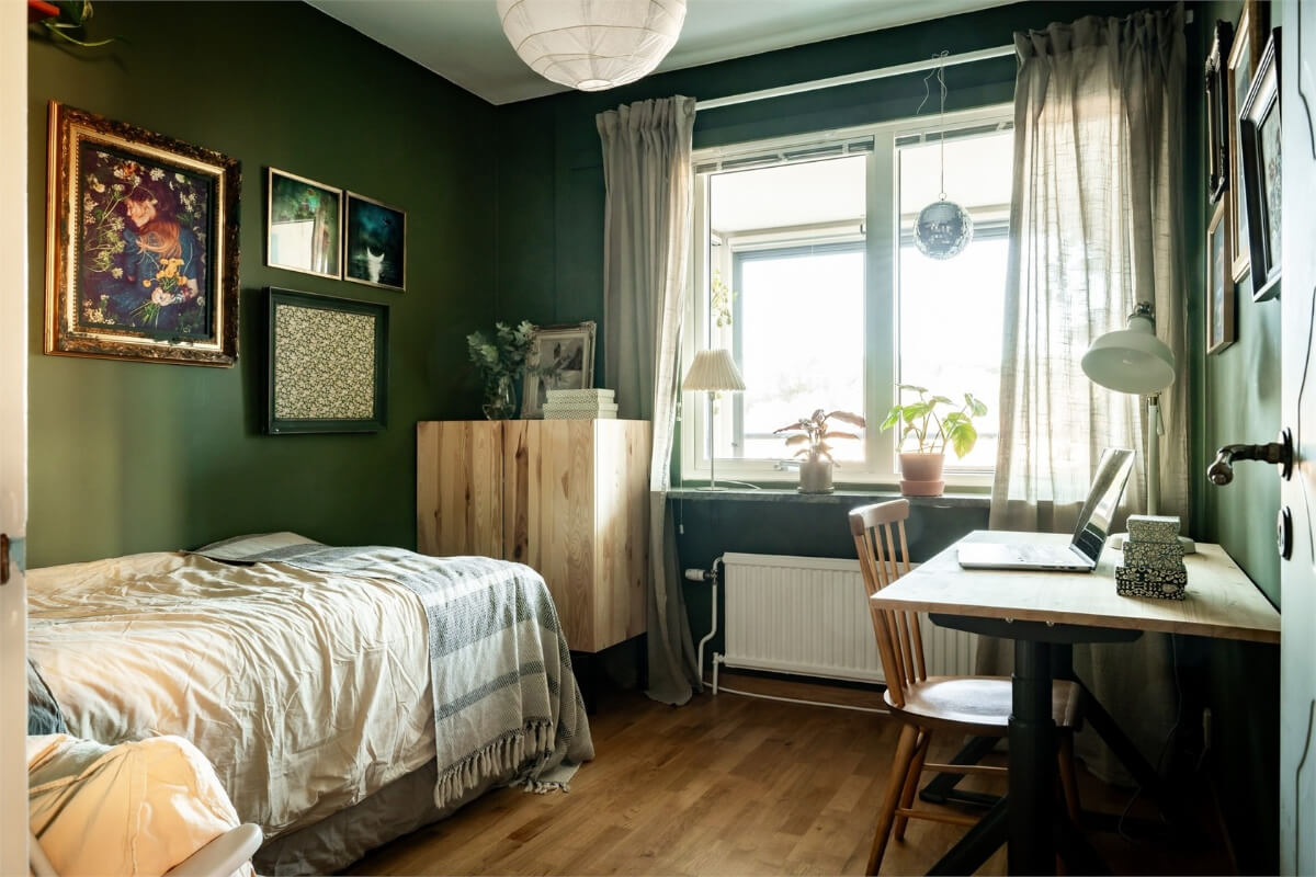 A Charming Apartment with Large Windows and Colorful Bedrooms 14 green bedroom with desk