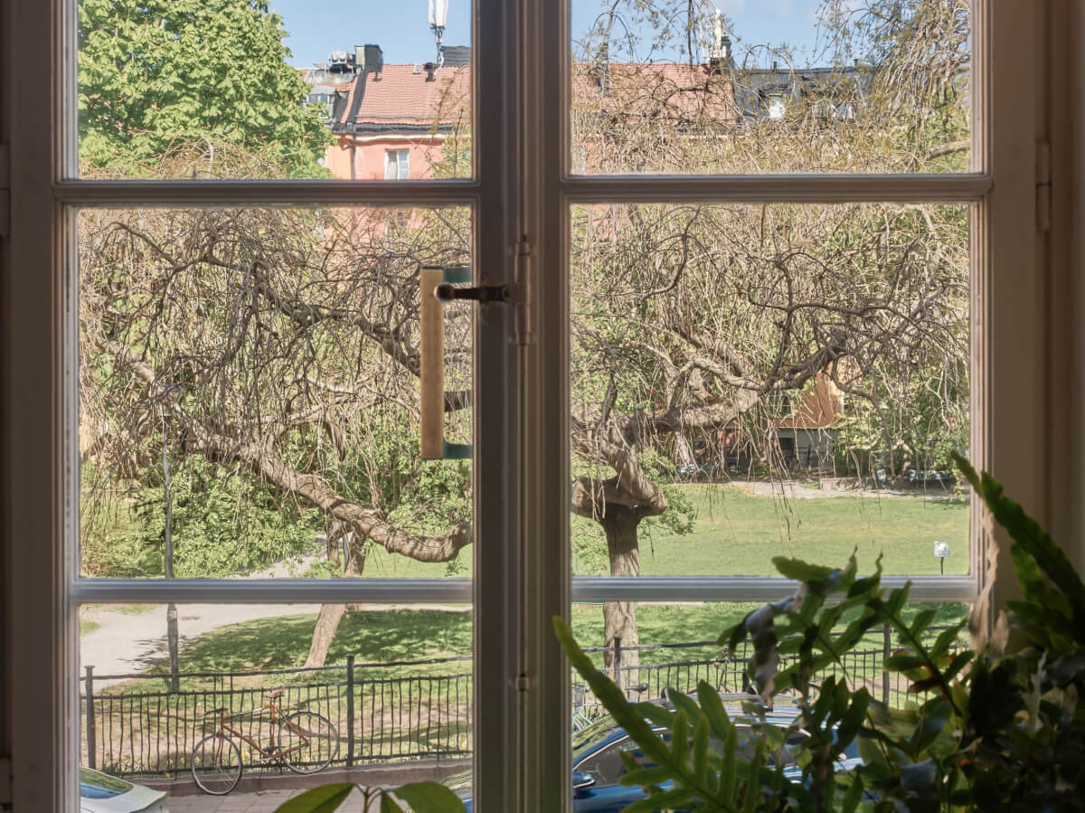 A Studio Apartment with Smart Storage Ideas and Exposed Brick 8 green courtyard view