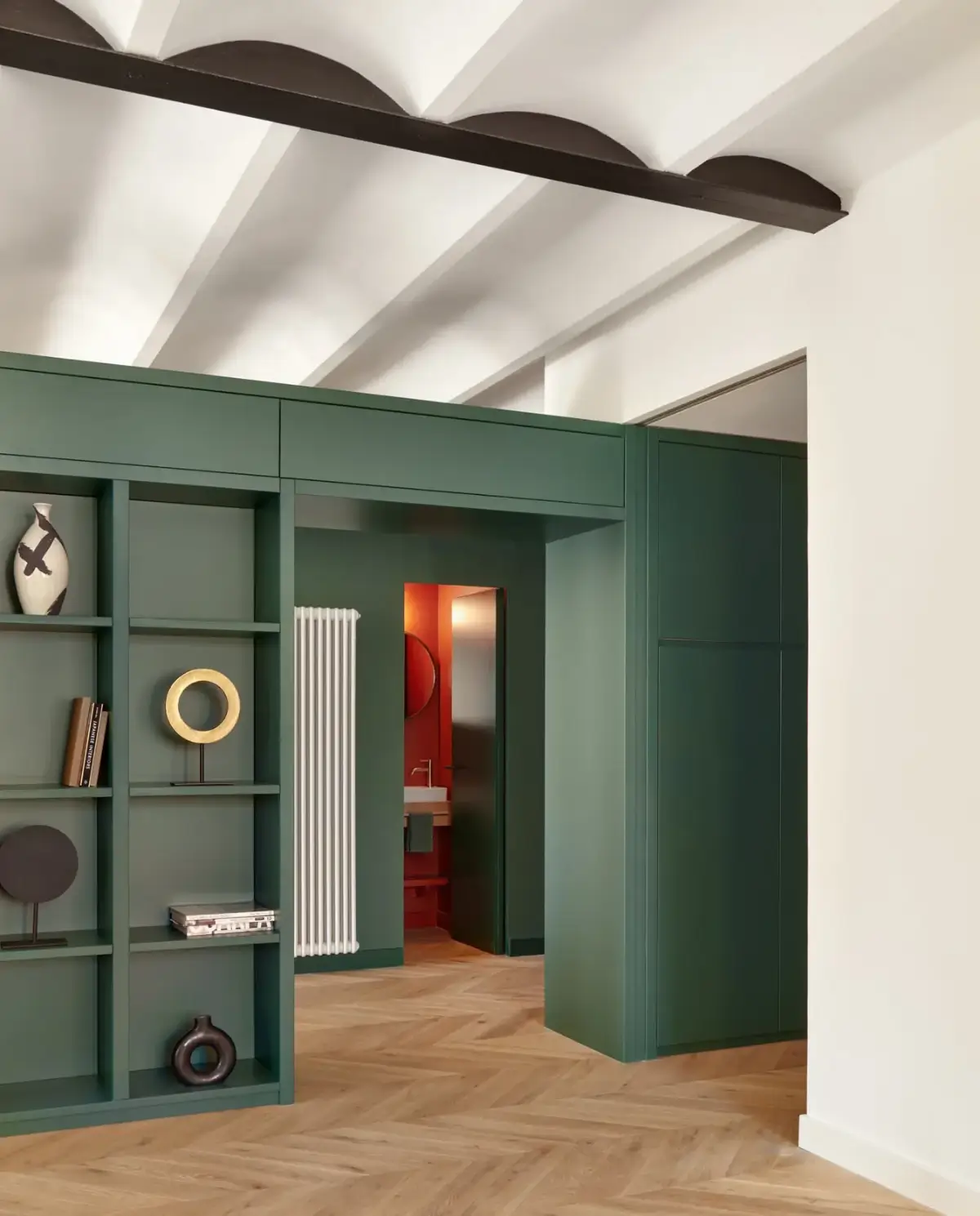 A Modern Barcelona Apartment with a Pink Bathroom 5 green doorway with storage
