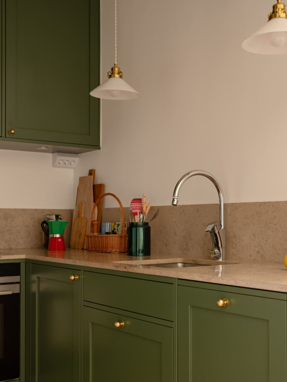 A Small Apartment with High Ceilings and a Large Bay Window 18 green kitchen brass knobs