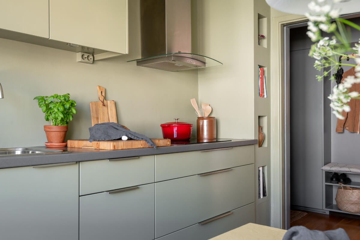 Light Rooms and a Moody Color Palette in a 1930s Apartment 18 green kitchen with niches