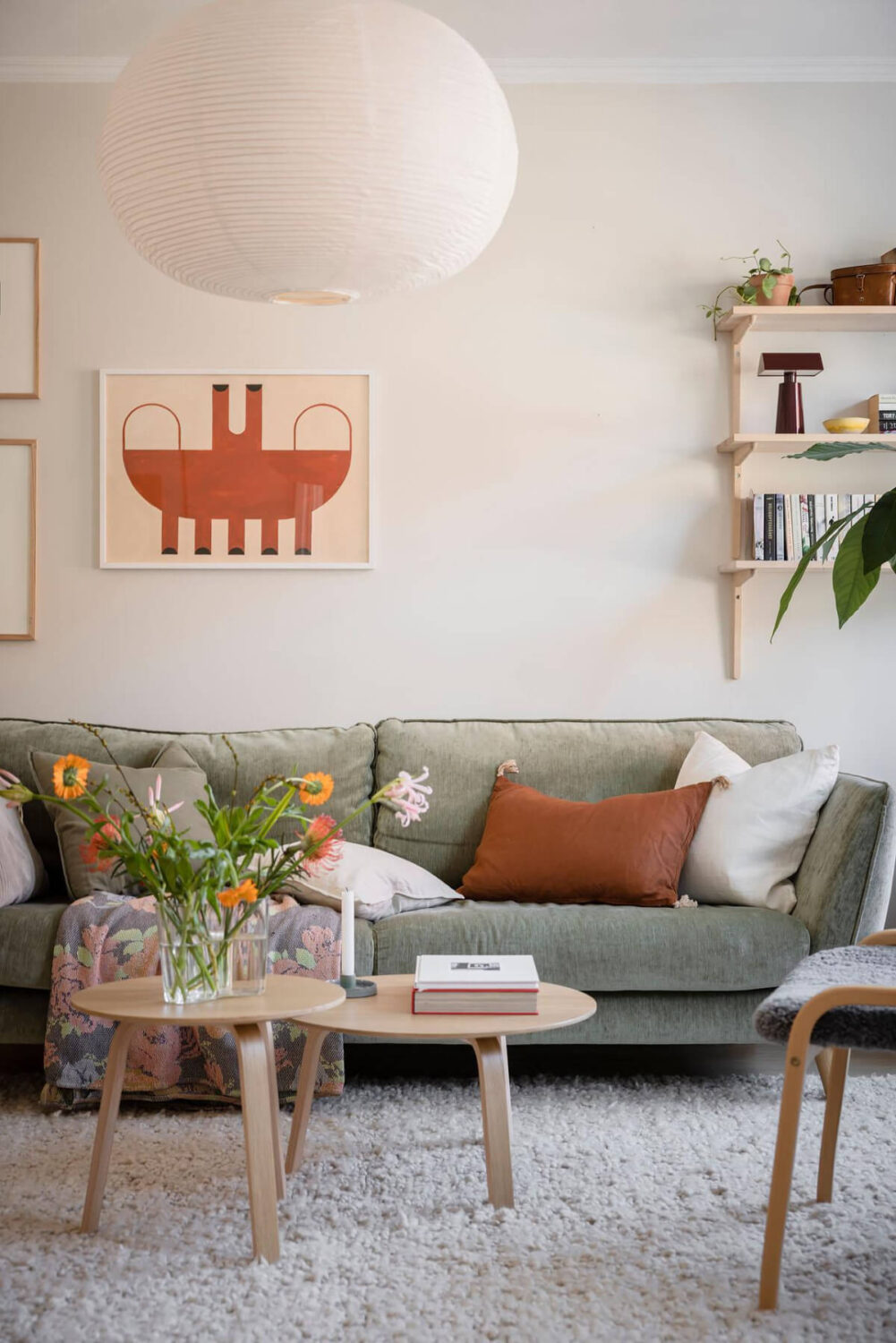 Bright Rooms with Light Color Tones in a Swedish Apartment 4 green sofa
