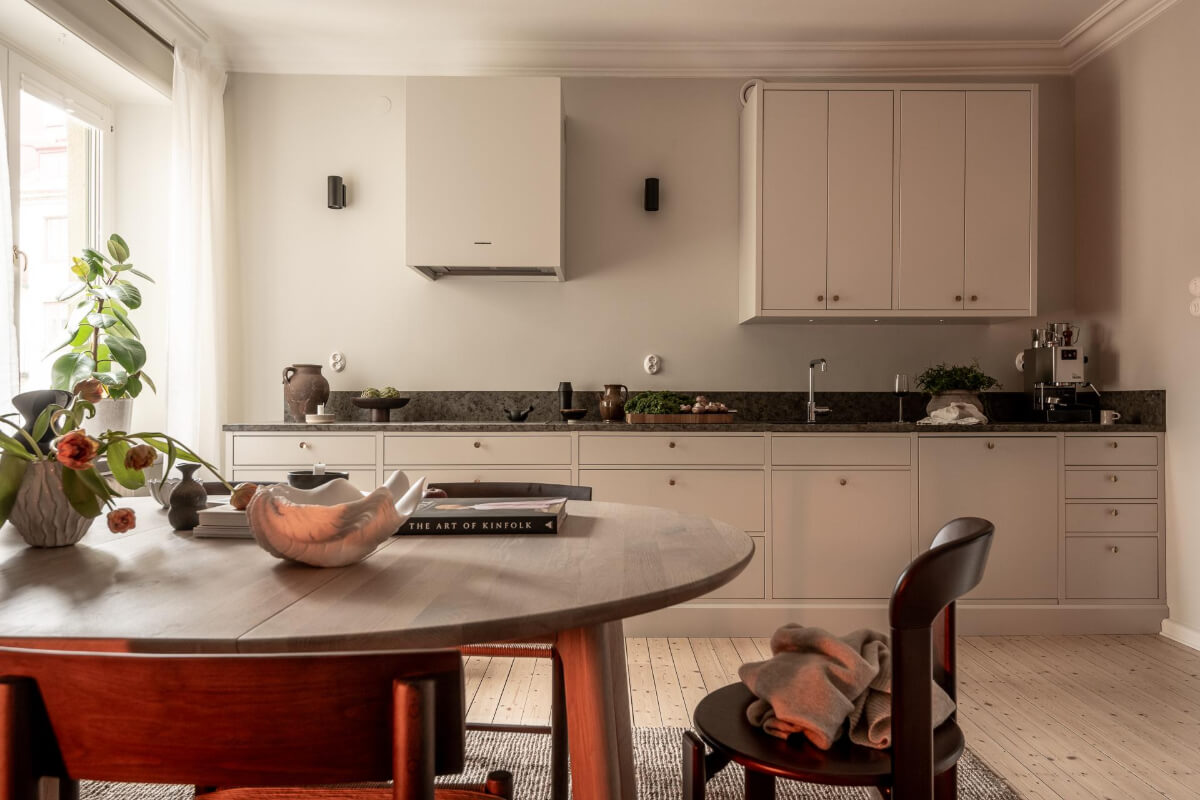 A Beautiful Calm 1920s Apartment in Gothenburg 10 greige kitchen with dining table