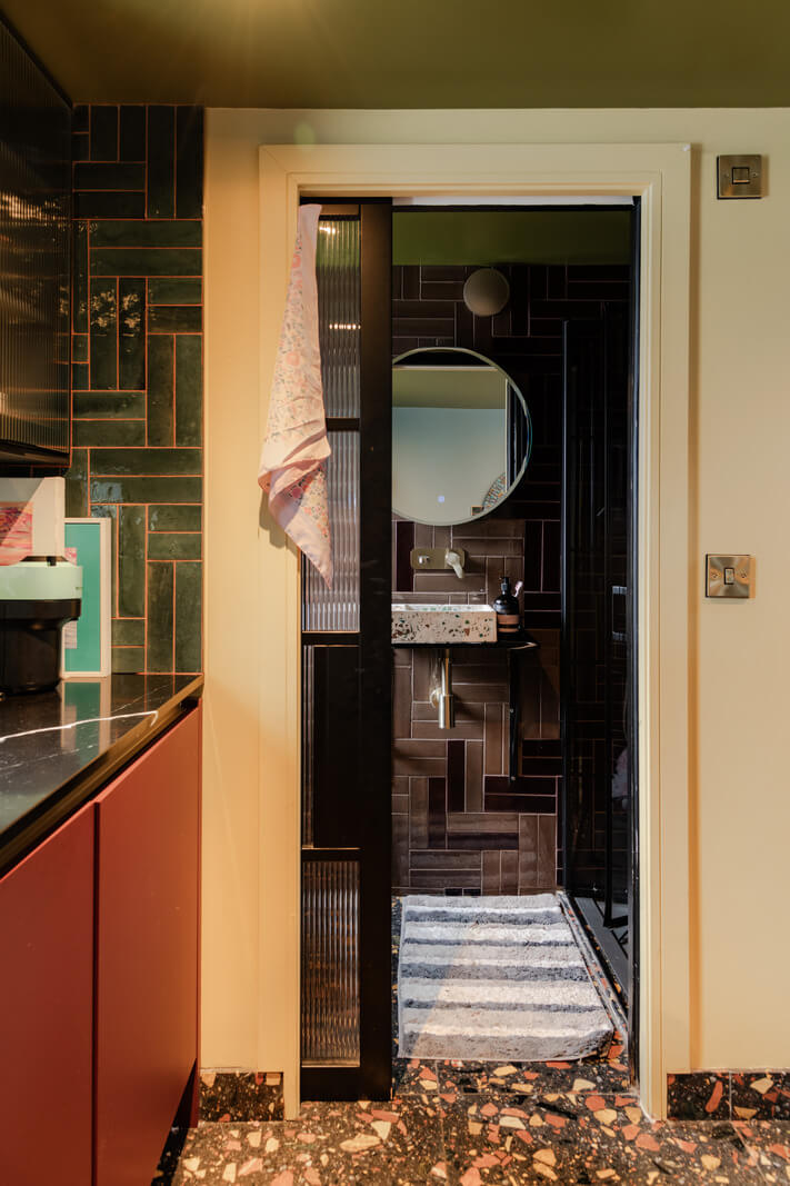 A Grand Victorian Villa in Manchester with Bold Interiors 34 guest house moody bathroom terrazzo floor tiles