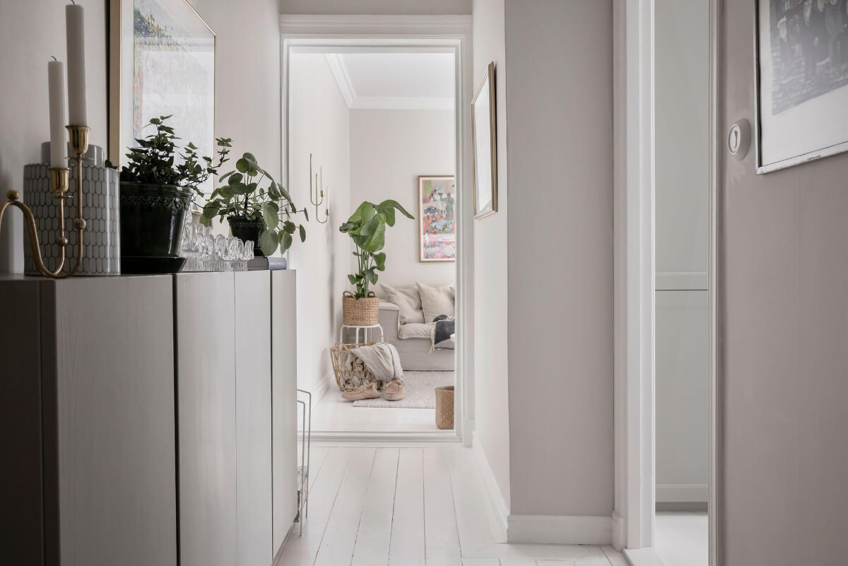 White-Painted Floorboards in a Turn-of-the-Century Apartment 23 hall ivar cabinets