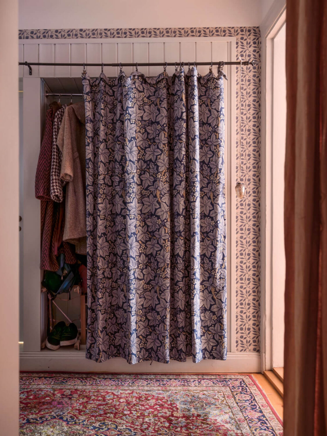 A Charming Home in a 17-Century Apartment in Stockholm's Old Town 27 hall storage with curtain