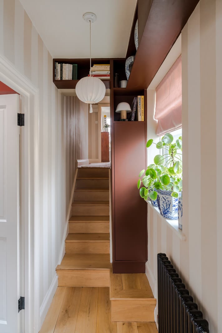 Cozy Contemporary Spaces in a Light-Filled Victorian Apartment 16 hall striped wallpaper high storage cabinets