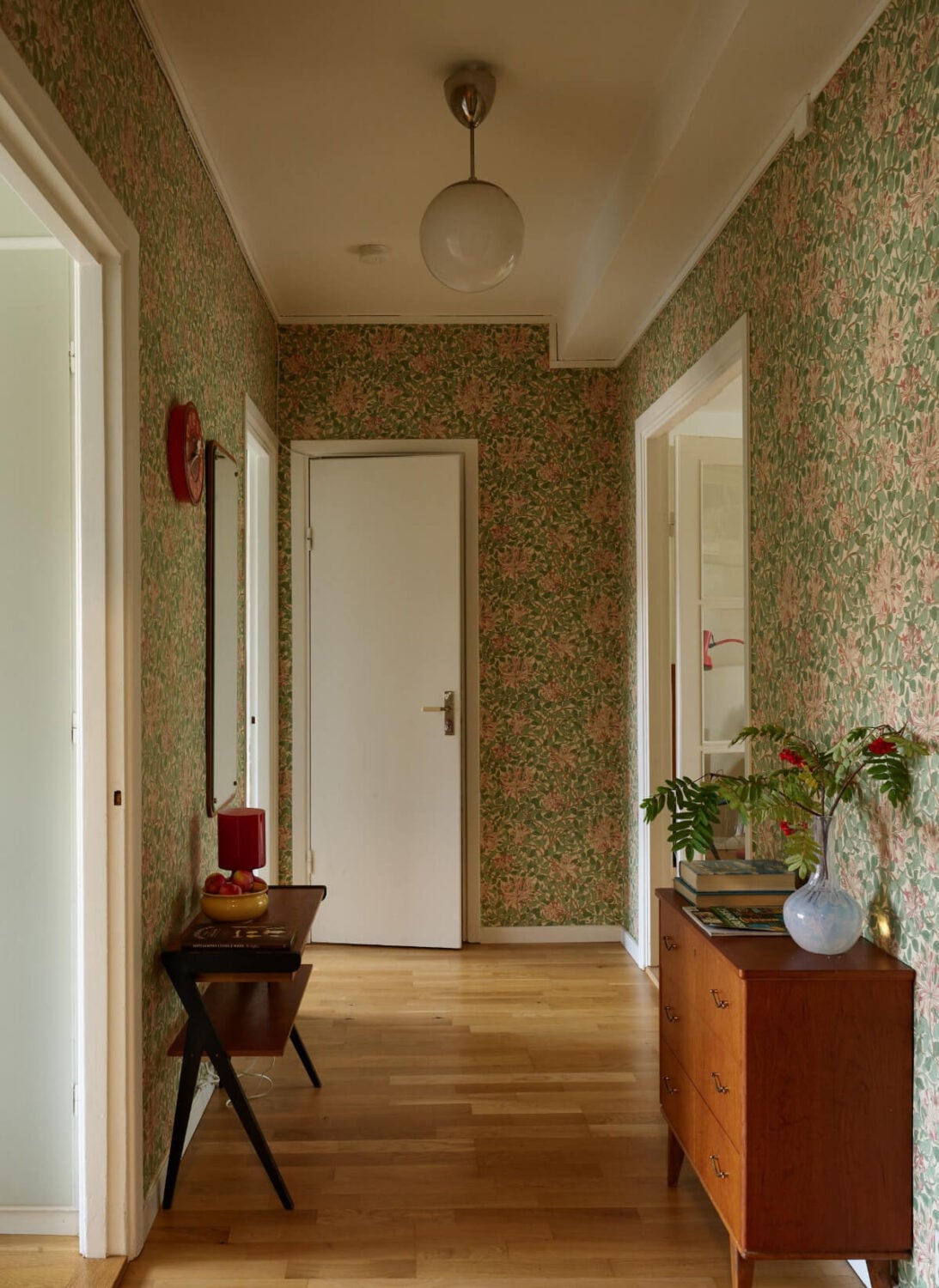 A Charming Midcentury Apartment with Original Features 9 hall william morris wallpaper