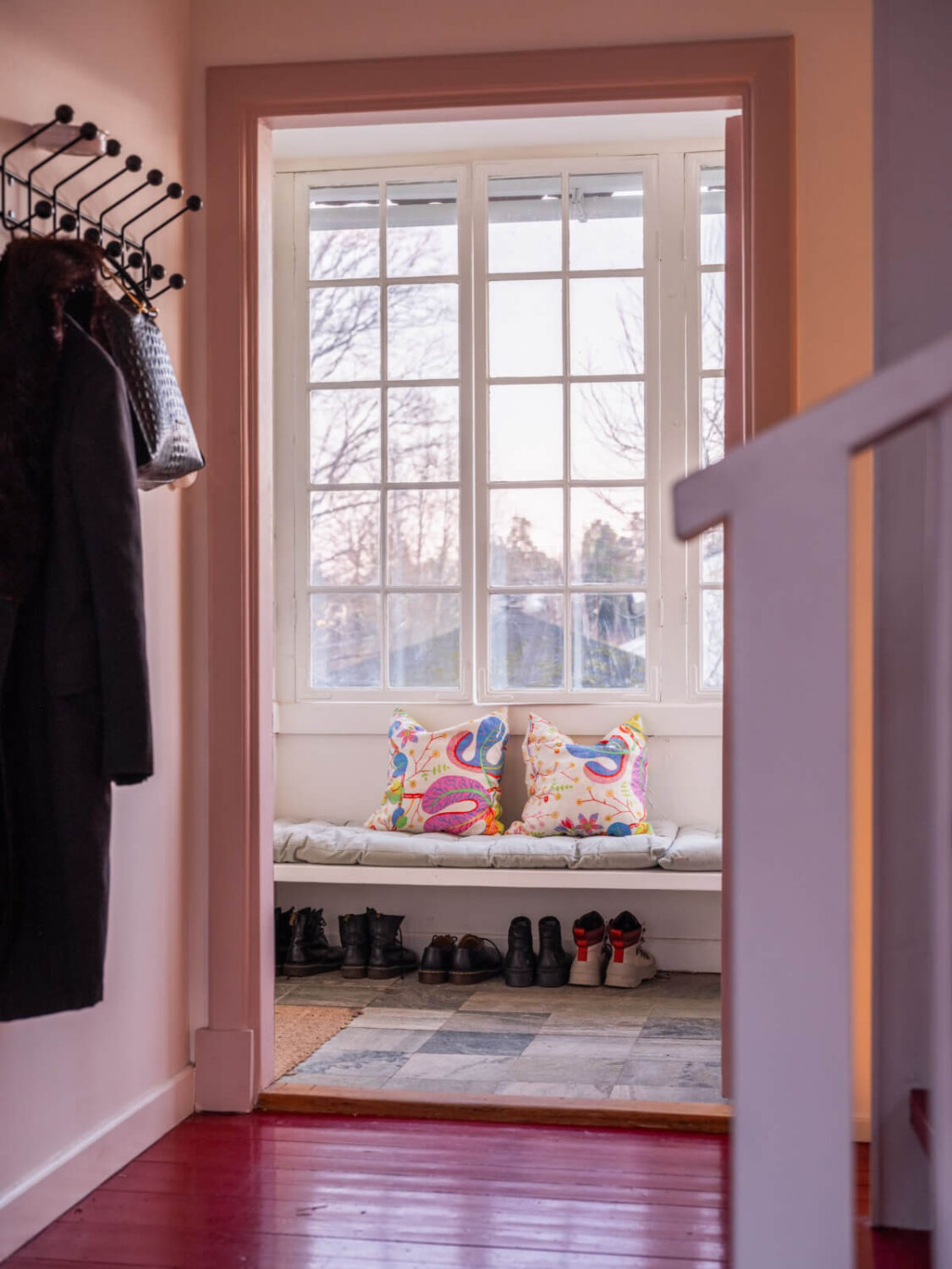 Painted Floorboards in a Unique Family Home in Sweden 17 hall with bench under window