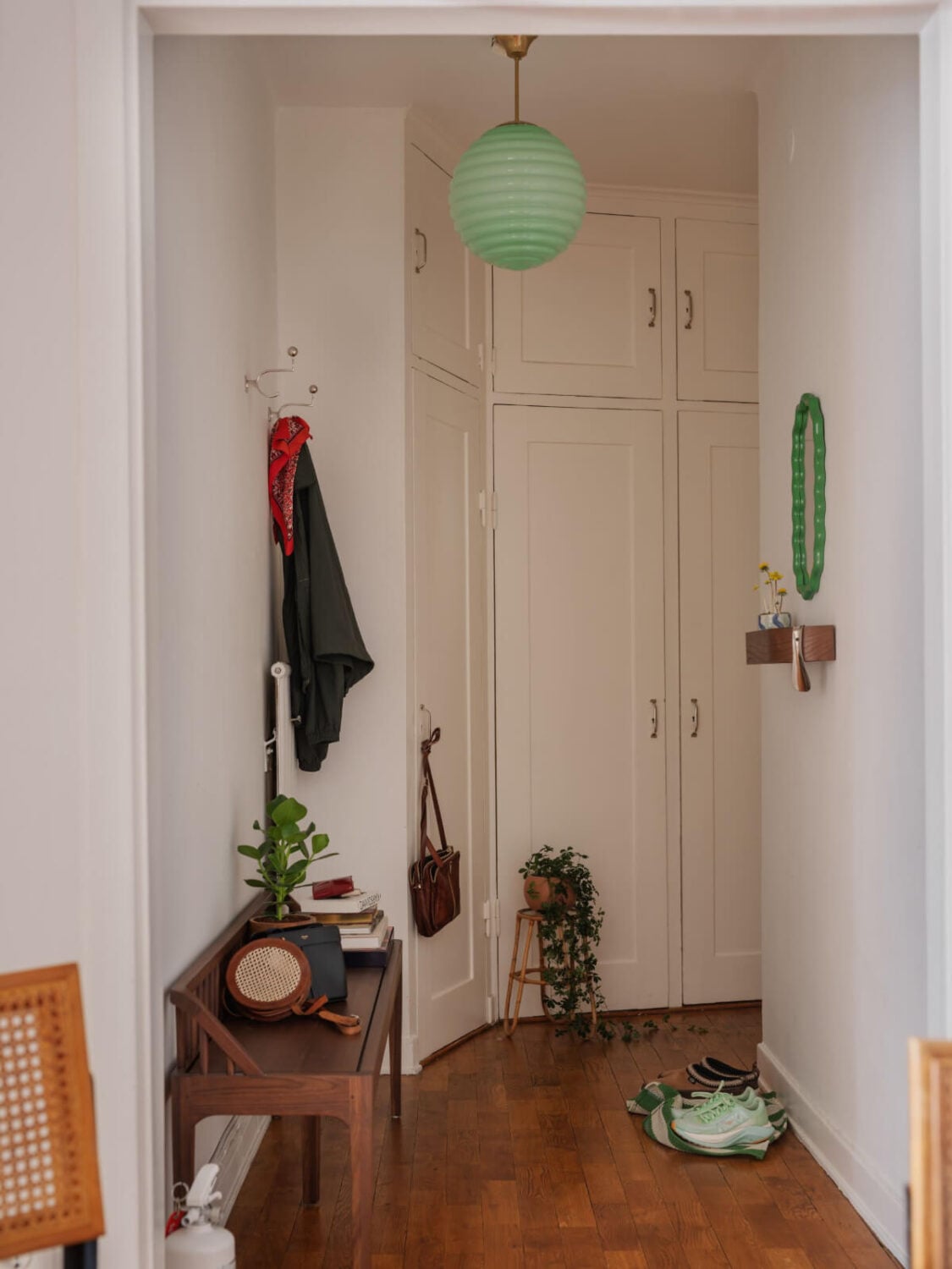 An Airy One-Bedroom Apartment with Art and A Yellow Kitchen 22 hall with built in wardrobes An Airy One-Bedroom Apartment with Art and A Yellow Kitchen