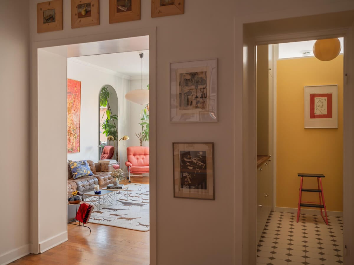 An Airy One-Bedroom Apartment with Art and A Yellow Kitchen 18 hall with living room and kitchen