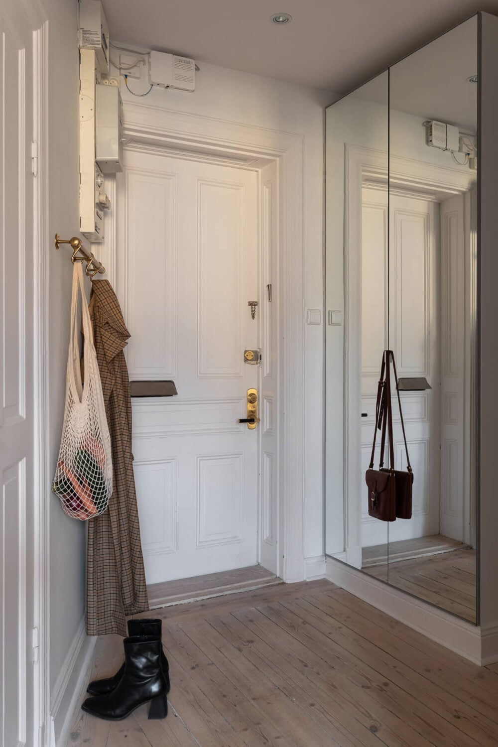 A Small Light Gray Apartment with Period Features 24 hall with mirror door wardrobes
