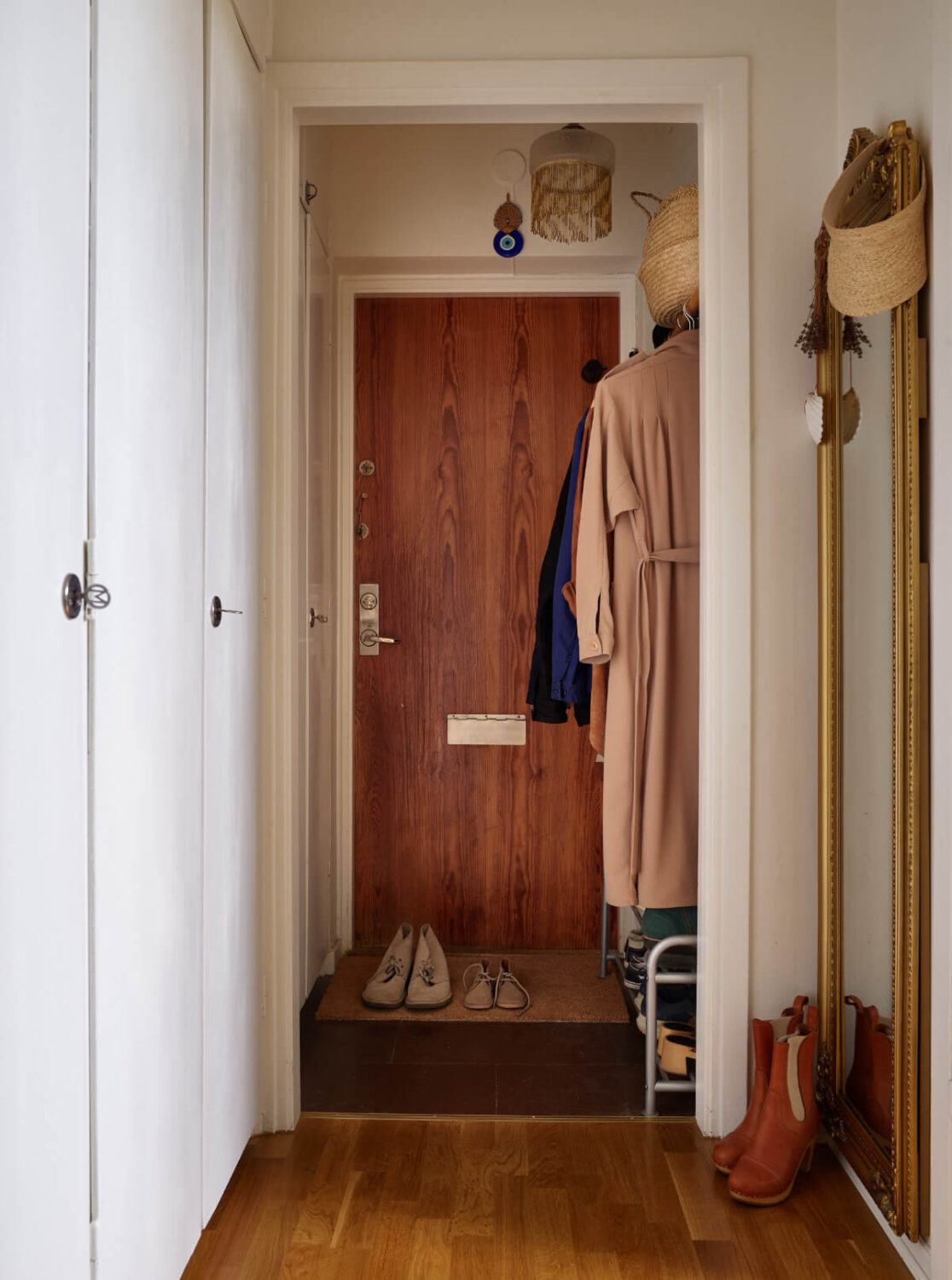A Small Vintage Apartment with a Tiny Green Patio Garden 22 hall with original built-in wardrobes