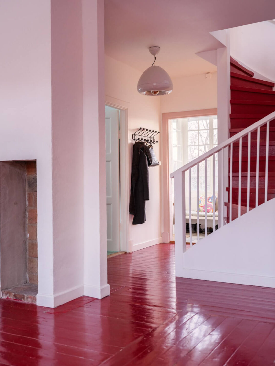 A Colored Sixth Wall May Be The Biggest Paint Trend in 2026 19 hall with red painted floorboards