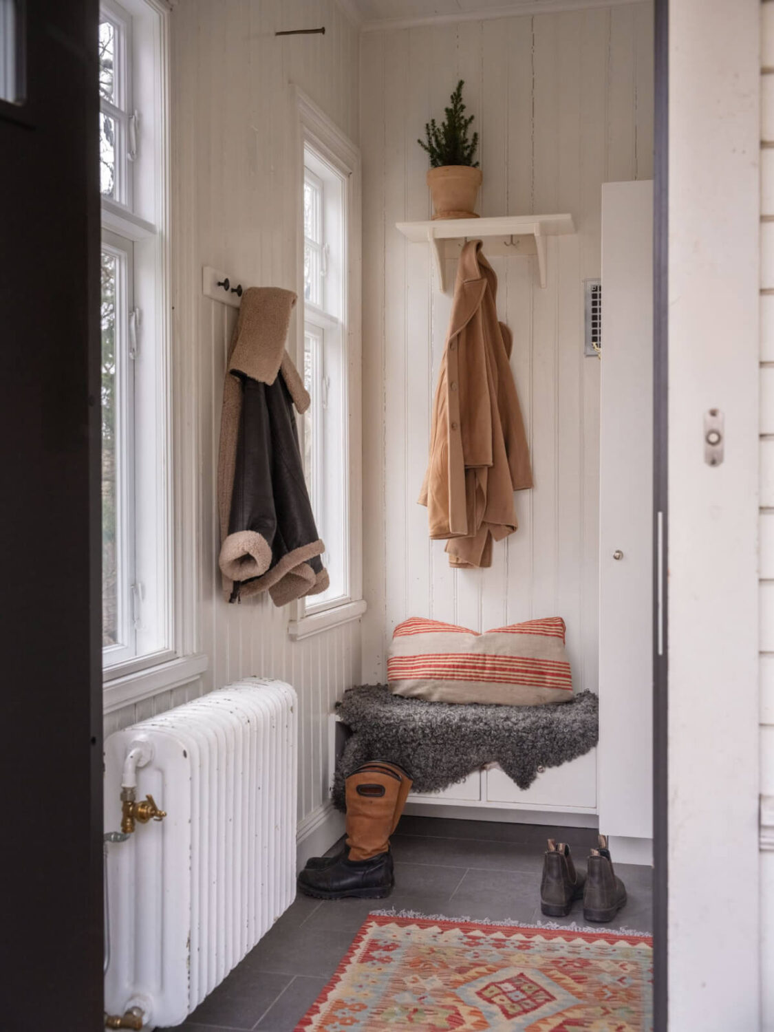 A Beautiful Turn-of-the-Century Family Home in Sweden 28 hall with small bench