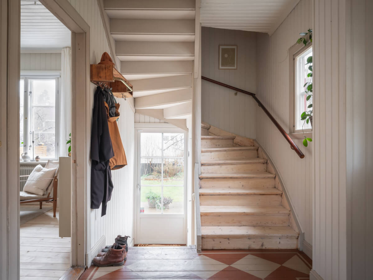 A Carefully Renovated Family Home in Sweden 26 hall with wooden staircase