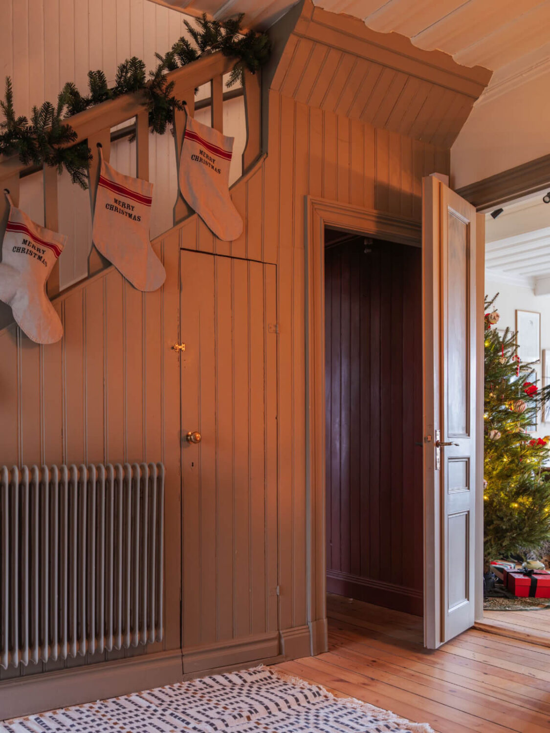 A Beautiful Turn-of-the-Century Family Home in Sweden 26 hallway christmas stockings staircase