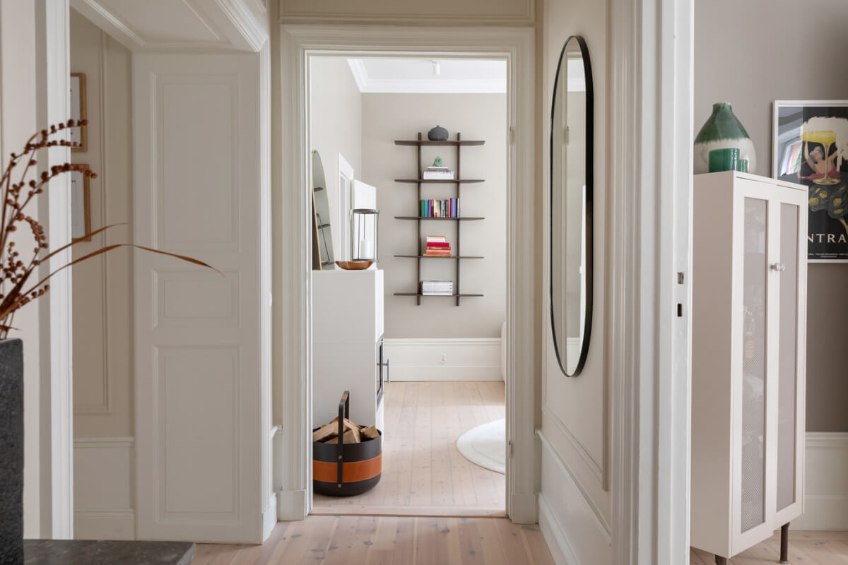 A Calm, Neutral Color Palette in a Classic Swedish Apartment 16 hallway large mirror