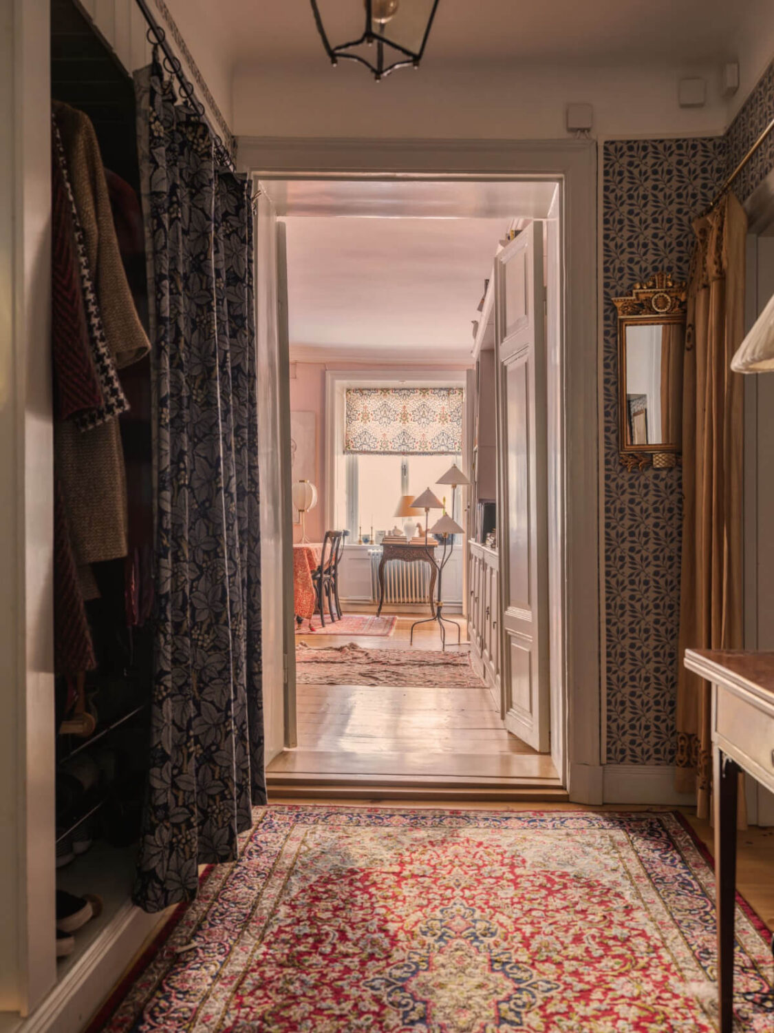 A Charming Home in a 17-Century Apartment in Stockholm's Old Town 26 hallway mixture of textiles