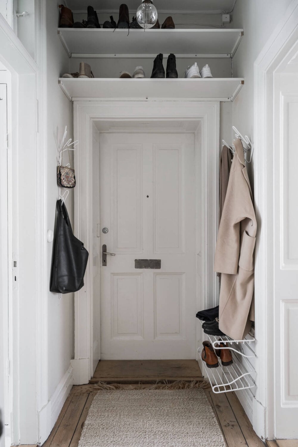 A Stylish Studio Apartment with Period Features and Large Windows 23 hallway shelves above door