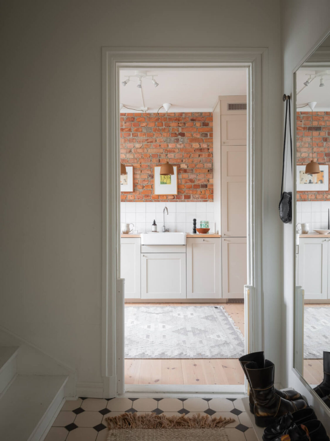 A Renovated Duplex Apartment with Exposed Brick Walls 26 hallway victorian floor tiles A Renovated Duplex Apartment with Exposed Brick Walls