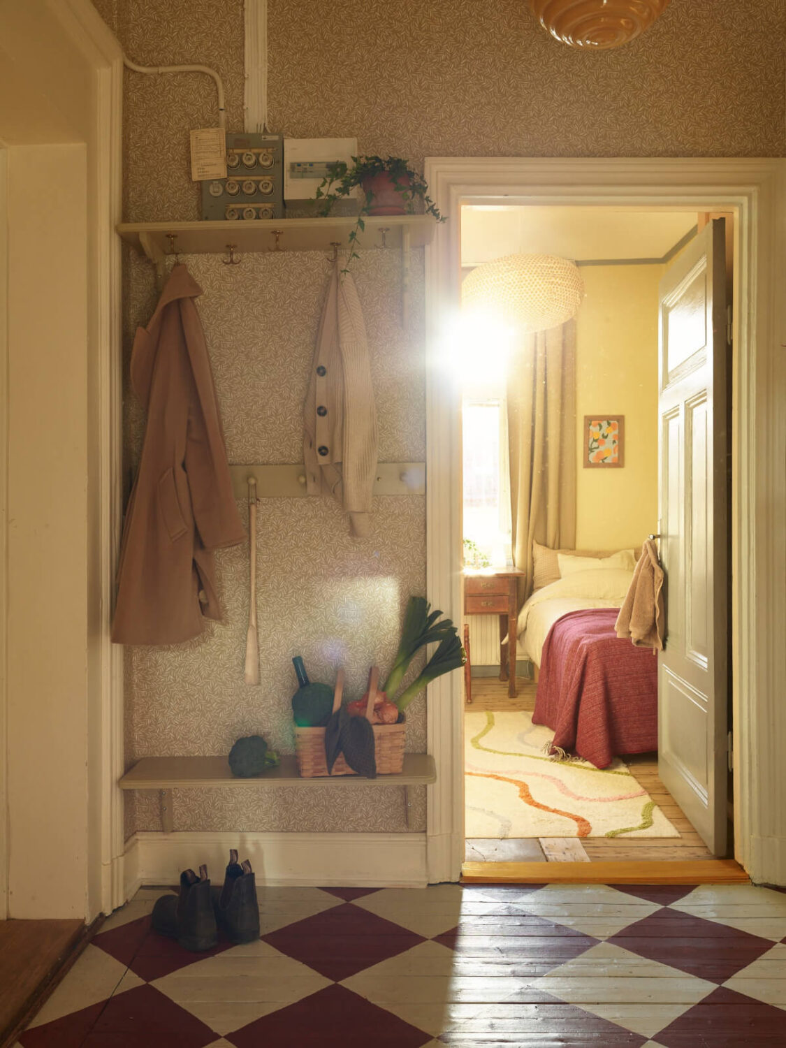 A Charming Historic Stockholm Apartment with a Blue Kitchen 30 hallway wallpaper red and white checkerboard floor