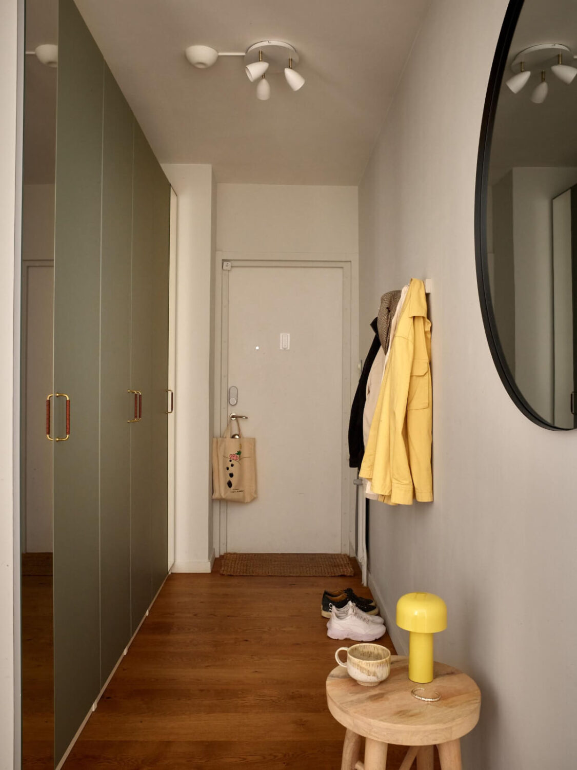 A Stockholm Apartment with a Beautifully Renovated Kitchen 17 hallway with large green wardrobes